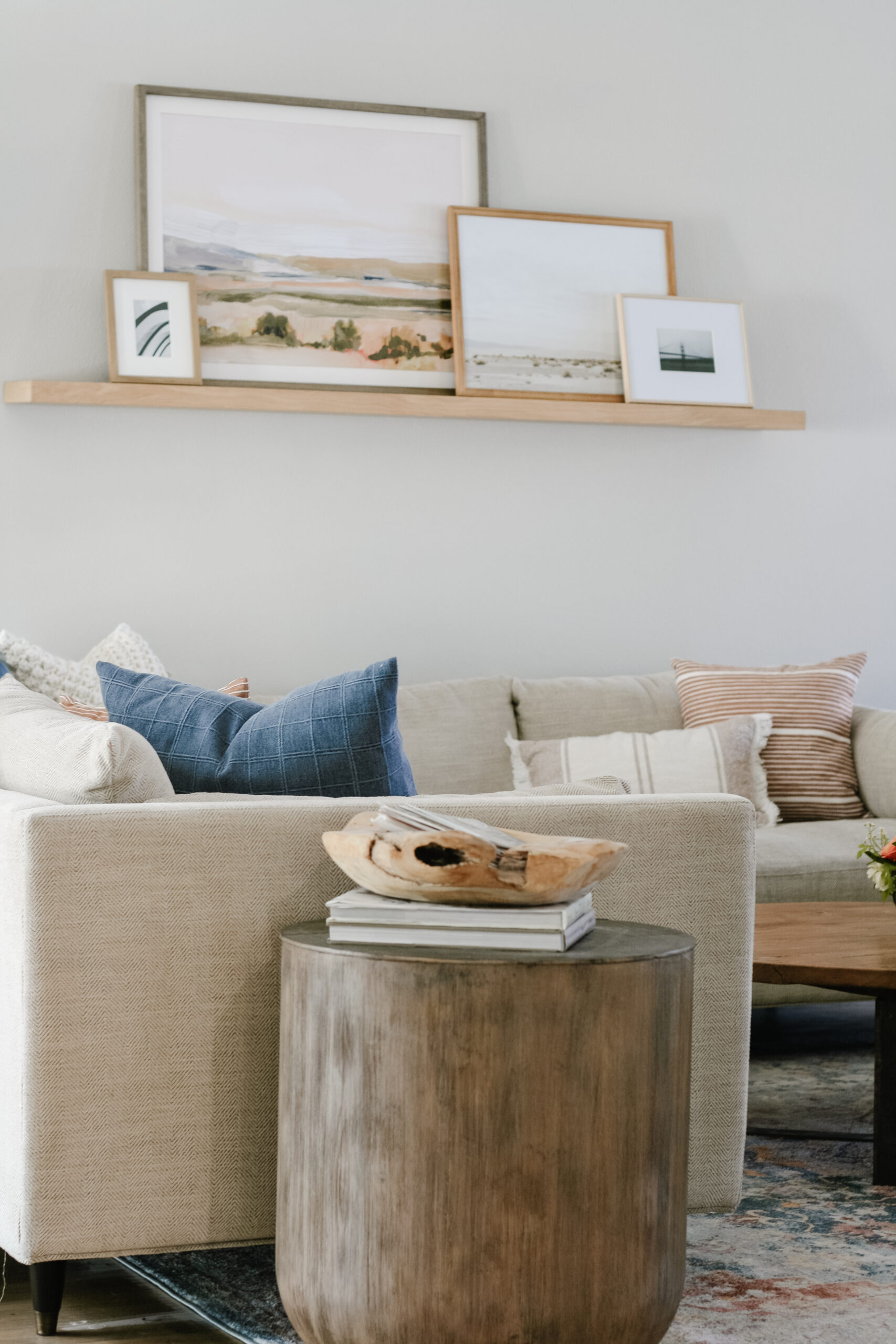 Leaning pictures on a floating shelf