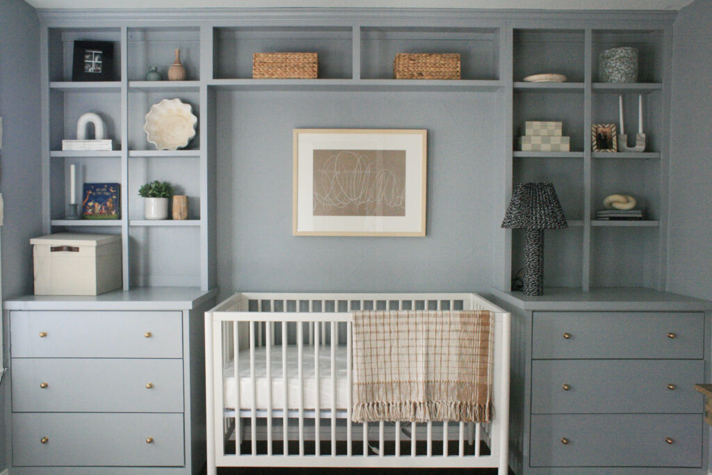 Boy's nursery with surrounding built ins around the crib